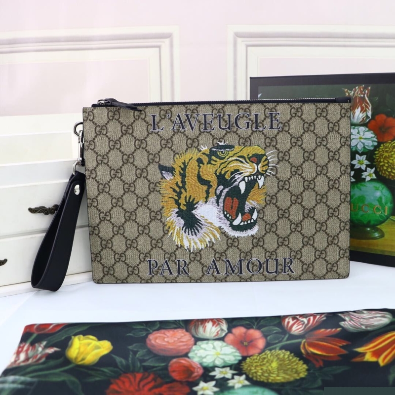 G*u*i clutch bags
